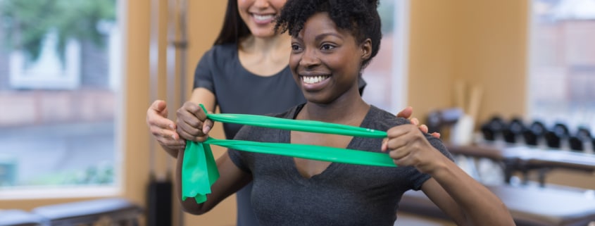 Physical therapy session with two women of color - Colorado Center of Orthopaedic Excellence PT vs OT