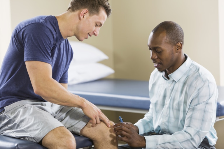 Physical therapist examining patient Colorado Center of