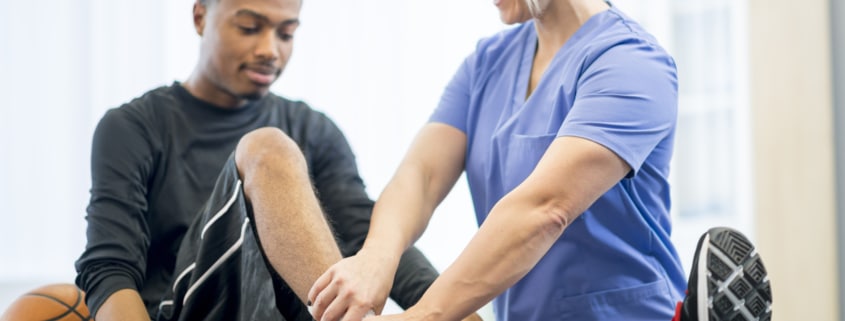 Basketball Player Getting Physical Therapy - Colorado Center of Orthopaedic Excellence sports medicine for sports injuries
